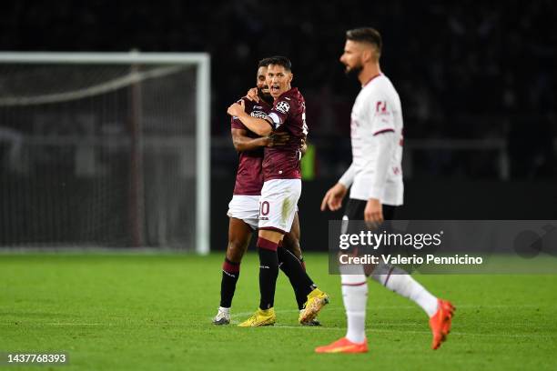 Sasa Lukic and Koffi Djidji of Torino FC celebrate their side's victory after the Serie A match between Torino FC and AC MIlan at Stadio Olimpico di...