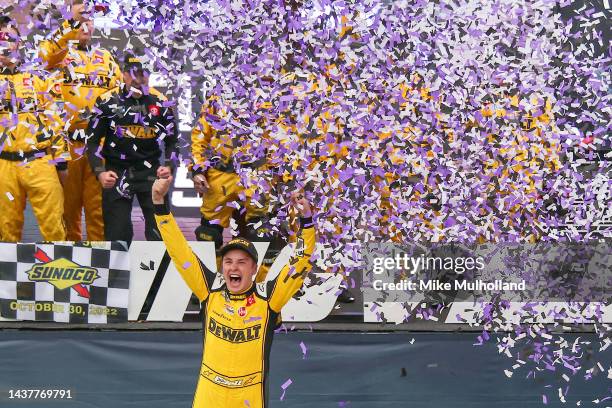 Christopher Bell, driver of the DeWalt Toyota, celebrates in victory lane after winning the NASCAR Cup Series Xfinity 500 at Martinsville Speedway on...