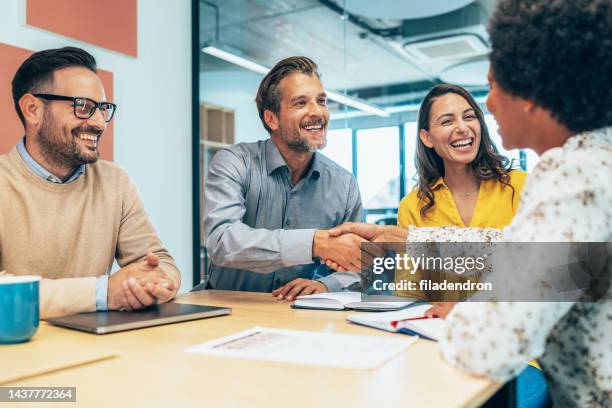 handshake for successful partnership - employee onboarding stock pictures, royalty-free photos & images