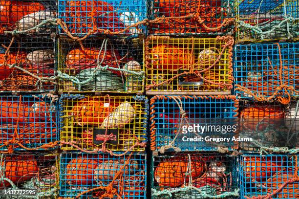 colorful lobster traps in new brunswick, canada - hummerkorb stock-fotos und bilder