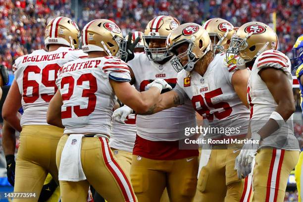 Christian McCaffrey of the San Francisco 49ers celebrates a touchdown during the fourth quarter against the Los Angeles Rams at SoFi Stadium on...