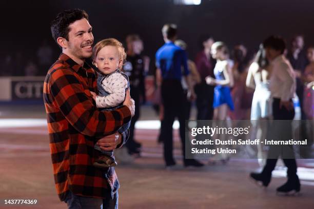 Keegan Messing of Canada holds his son, Wyatt, on the ice after the Gala Exhibition during the ISU Grand Prix of Figure Skating - Skate Canada...