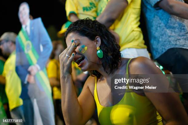 Supporters of candidate Jair Bolsonaro of Liberal Party show dejection after candidate Luiz Inácio Lula da Silva of Workers' Party is announced as...