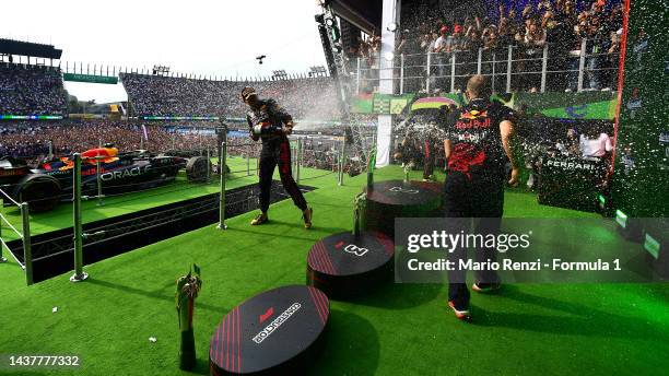 Race winner Max Verstappen of the Netherlands and Oracle Red Bull Racing and race engineer Gianpiero Lambiase celebrate on the podium during the F1...