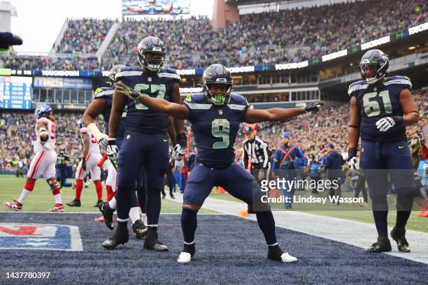 Kenneth Walker III of the Seattle Seahawks celebrates a touchdown against the New York Giants during the fourth quarter at Lumen Field on October 30,...