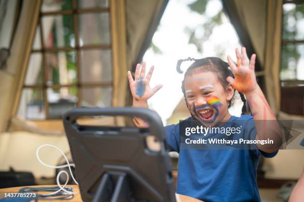 video call girl with friends halloween theme - school teacher light stock pictures, royalty-free photos & images