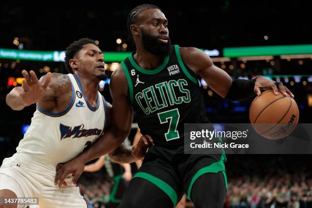 Jaylen Brown of the Boston Celtics drives against Bradley Beal of the Washington Wizards during the game at TD Garden on October 30, 2022 in Boston,...