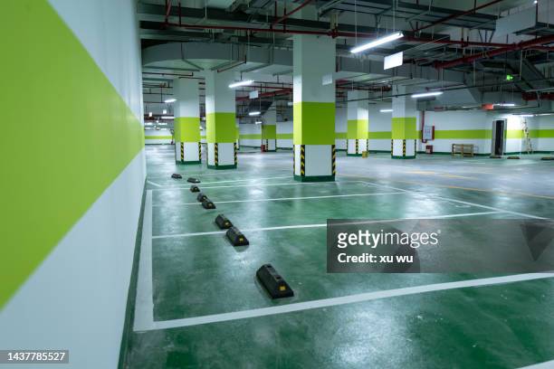 underground parking space - parking garage stock-fotos und bilder