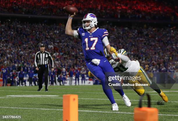 Josh Allen of the Buffalo Bills throws a touchdown pass during the first quarter against the Green Bay Packers at Highmark Stadium on October 30,...