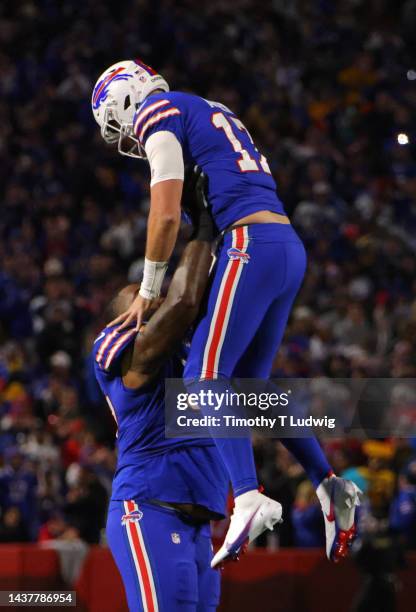 Jordan Phillips and Josh Allen of the Buffalo Bills celebrate after a touchdown during the first quarter against the Green Bay Packers at Highmark...