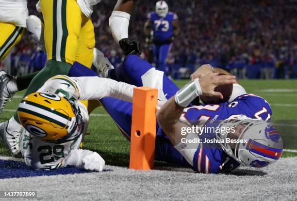 Josh Allen of the Buffalo Bills is tackled by Rasul Douglas of the Green Bay Packers near the goal line during the first half at Highmark Stadium on...