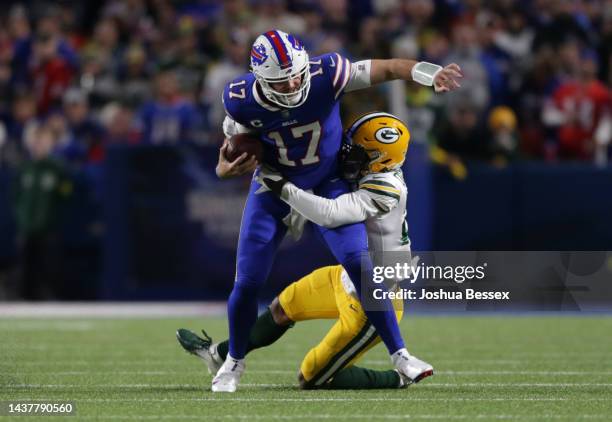 Rasul Douglas of the Green Bay Packers tackles Josh Allen of the Buffalo Bills during the first quarter at Highmark Stadium on October 30, 2022 in...