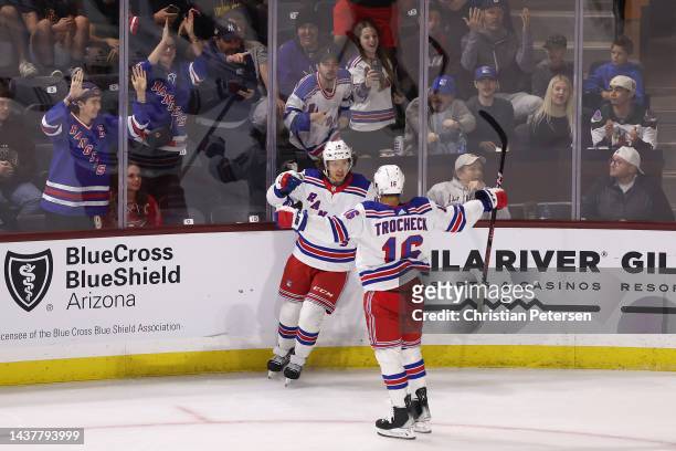 Artemi Panarin and Vincent Trocheck of the New York Rangers celebrate after Panarin scored a goal against the Arizona Coyotes during the second...
