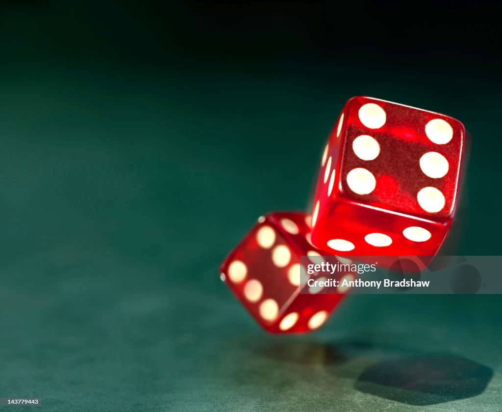 Tumbling red dice