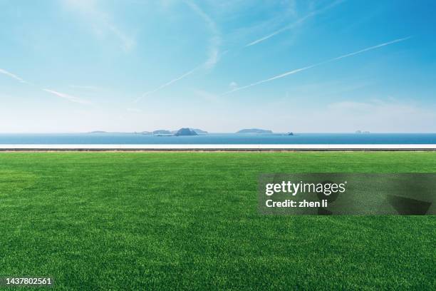 lawn by the sea - horizon over land road stock pictures, royalty-free photos & images