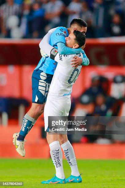 Erick Sanchez and Oscar Ustari of Pachuca celebrate their team's third goal during the final second leg match between Pachuca and Toluca as part of...
