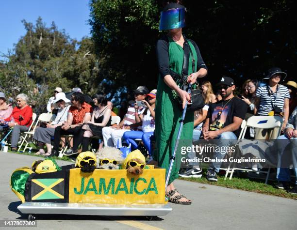 Participants dressed as a Jamaican bobsled team are seen during the Haute Dog Howl'oween Parade at Marina Vista Park on October 30, 2022 in Long...