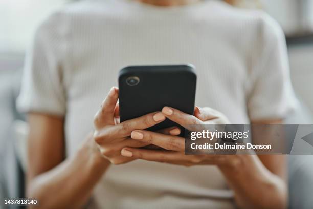 home woman hands, social media and phone contact, communication and smartphone technology in living room. closeup mobile app multimedia, reading internet fake news online and 5g web social networking - mobiel stockfoto's en -beelden