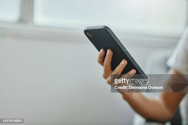 hand, phone and woman in home for closeup while on internet, social media or app for typing message. zoom, macro and smartphone for text, communication or message on web, social network or 5g tech - telegram messaging app bildbanksfoton och bilder