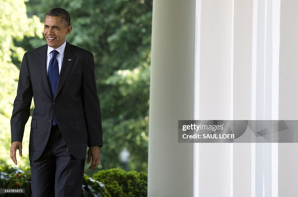 US President Barack Obama walks down the