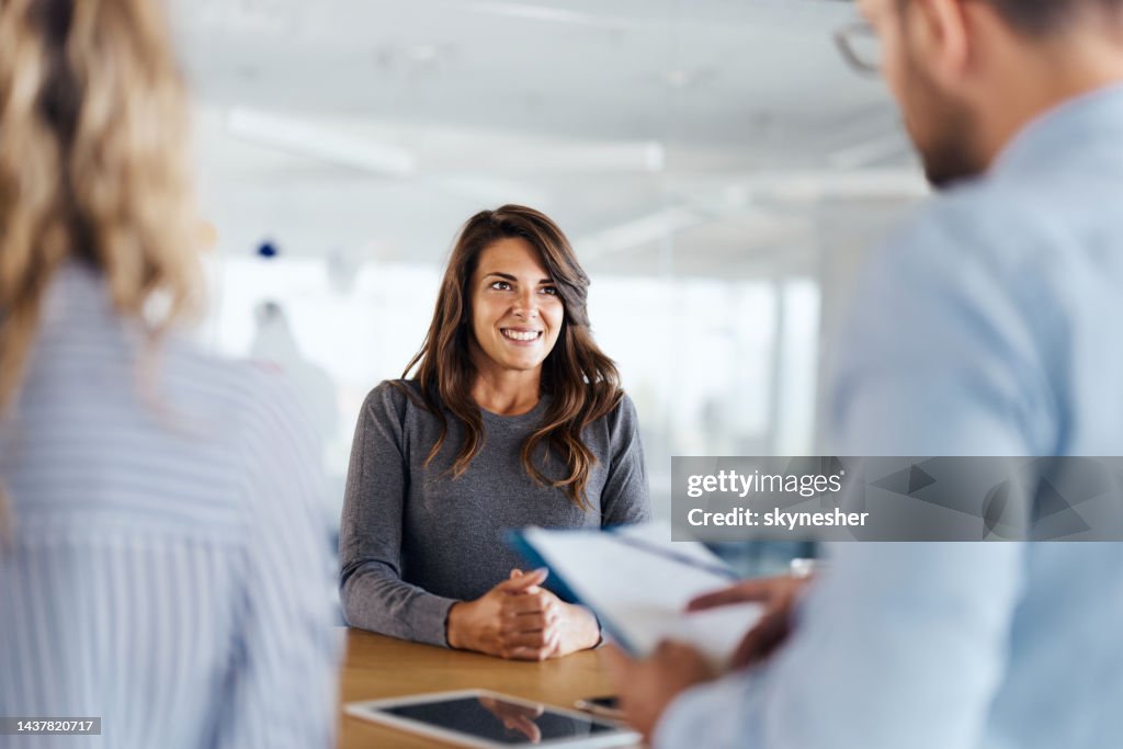 Happy female candidate on a job interview in the office.