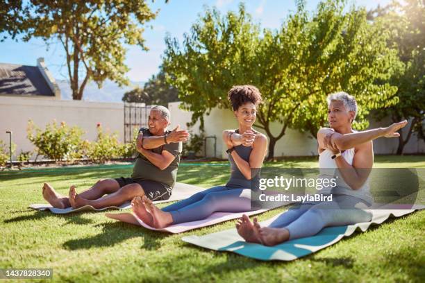 family, mother and father doing yoga with girl in nature fitness training, exercise and relaxing workout outdoors. healthy mom, dad and happy woman stretching in pilates together on grass in mexico - senior people training imagens e fotografias de stock