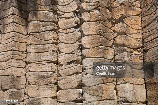 full frame of texture, closed of natural yellow basalt stone - lava stone stock pictures, royalty-free photos & images
