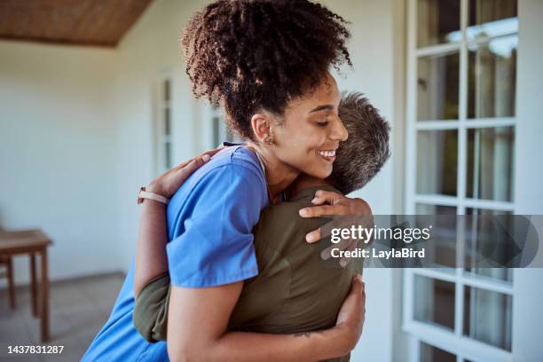 healthcare, nurse hugging elderly patient on patio of nursing home after care, support and recovery. senior woman, hug and trust, black woman doctor or medical caregiver at retirement home in brazil. - hospitium stockfoto's en -beelden