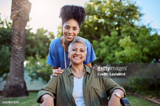 senior woman, wheelchair and medical nurse in nursing home or brazil house garden in trust, life insurance security or support. portrait, smile and happy retirement volunteer in disability healthcare - nursing assistant imagens e fotografias de stock