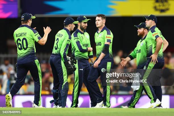 Josh Little of Ireland celebrates with team mates after taking the wicket of Glenn Maxwell of Australia for 13 runs during the ICC Men's T20 World...