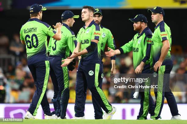 Josh Little of Ireland celebrates with team mates after taking the wicket of Glenn Maxwell of Australia for 13 runs during the ICC Men's T20 World...