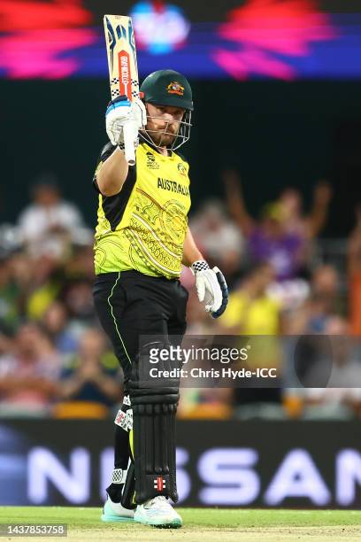 Aaron Finch of Australia celebrates reaching a half century during the ICC Men's T20 World Cup match between Australia and Ireland at The Gabba on...