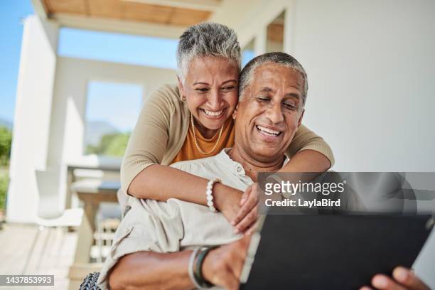 tablet, retirement and senior couple on outdoor patio reading website for online quote, wealth and asset management research. elderly, senior people happy with digital app life insurance information - mature reading computer stock pictures, royalty-free photos & images