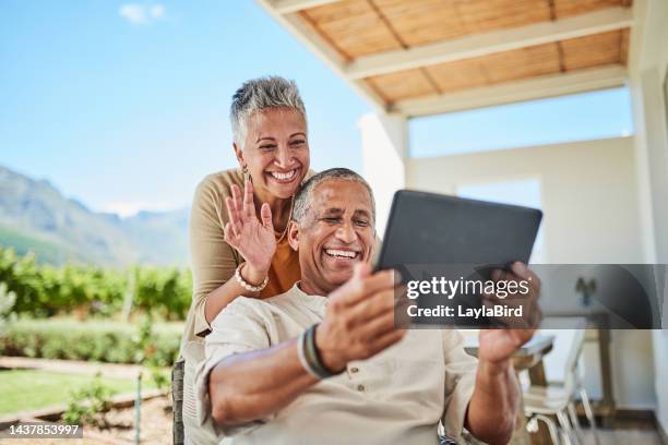 video call, digital tablet and senior couple relax on patio, happy, smiling and excited to talk to family. travel, love and elderly man and woman laughing at online conversation from holiday terrace - tablet couple stock pictures, royalty-free photos & images