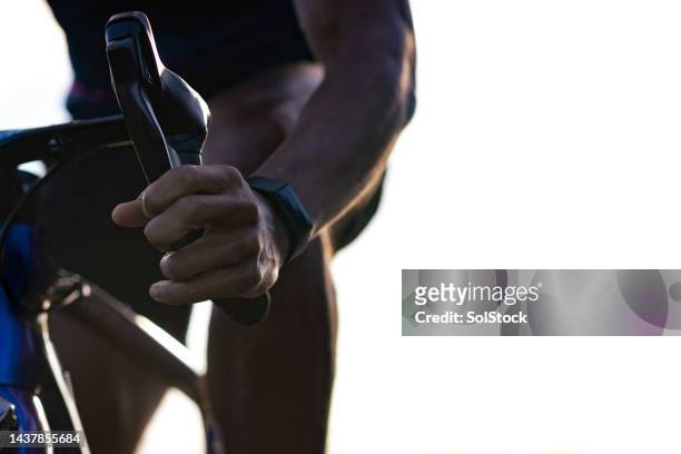 young adult pulling brake - bike handle stock pictures, royalty-free photos & images