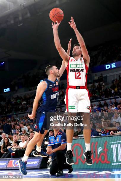 Todd Blanchfield of the Wildcats shoots against Chris Goulding of United during the round five NBL match between Melbourne United and Perth Wildcats...