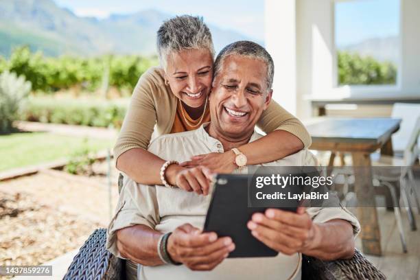 outdoor, online and senior couple using a tablet for video call, internet and social media. old man and woman with digital tech for chatting, call and texting on retirement home patio in mexico - senior couple smiling stock pictures, royalty-free photos & images