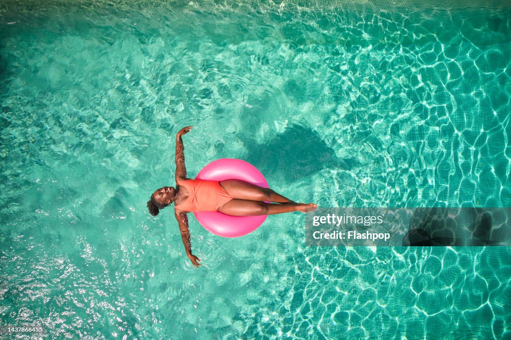 Aerial view point of a woman in a swimming pool