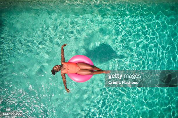 aerial view point of a woman in a swimming pool - vacation stock pictures, royalty-free photos & images