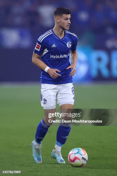 Tom Krauss of Schalke in action during the Bundesliga match between FC Schalke 04 and Sport-Club Freiburg at Veltins-Arena on October 30, 2022 in...