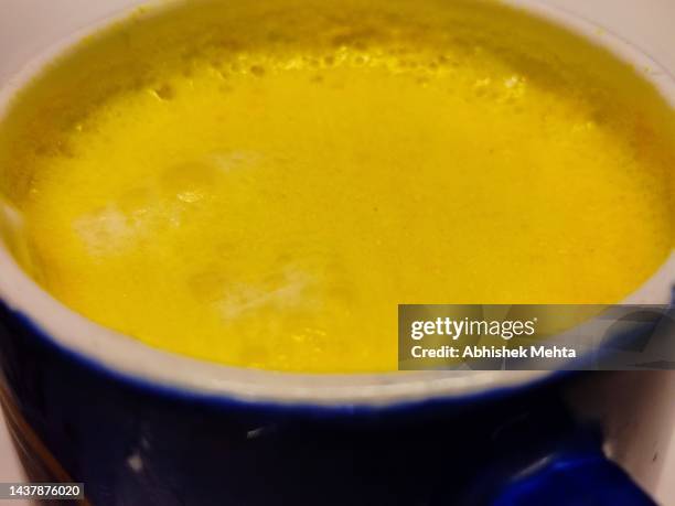 saffron turmeric milk - yellow milk stock-fotos und bilder