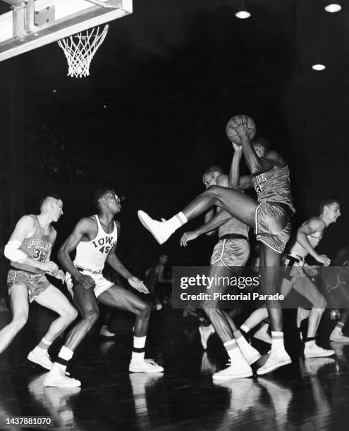American basketball player Robert Feldman of Purdue in action against American basketball player Nolden Gentry of Iowa and American basketball player...