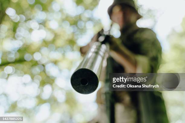 soldier of ukrainian armed forces on positions in the forest - silencer stock pictures, royalty-free photos & images