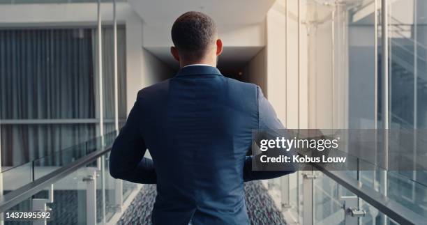 back view, office corridor and business man walking in company workplace ready for work. rear view, employee or male ceo, manager and leader going to corporate boardroom for sales or finance meeting. - rear view of man stock pictures, royalty-free photos & images