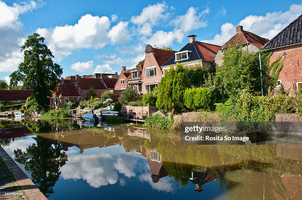 Reflections of houses in Winsum