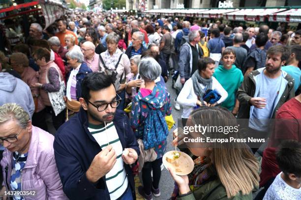 Two people eat 'pintxos' at the 'Last Monday of October' Basque agricultural fair, Oct. 31 in Gernika-Lumo, Biscay, Basque Country, Spain. After two...