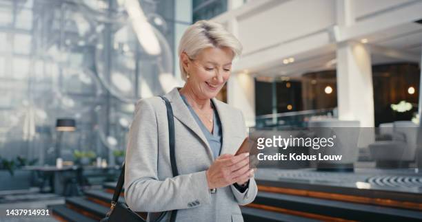 phone, happy corporate woman and smile reading online news or video conference call in modern workplace. senior businesswoman, email notification and 5g tech mobile message communication internet app - business people and paper imagens e fotografias de stock