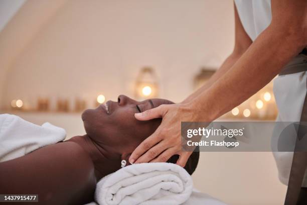 woman having a professional  massage at a wellness spa. - woman massage stock pictures, royalty-free photos & images