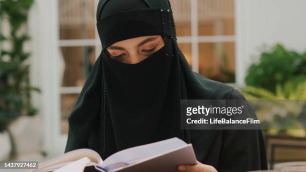 islamic females in black religion dress with niqab by wearing hijab. - niqab stock pictures, royalty-free photos & images