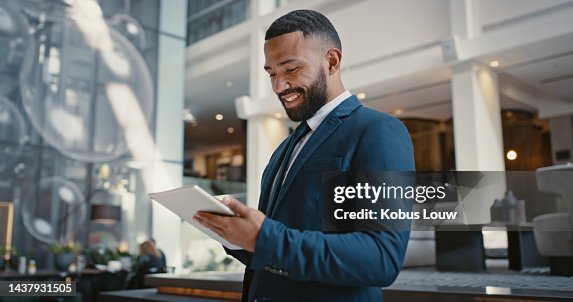 Businessman, digital tablet or strategy planning in hotel conference lobby or airport travel lounge. Happy smile, corporate worker or technology app to budget company finance or schedule target goals Businessman, digital tablet or strategy planning in hotel conference lobby or airport travel lounge. Happy smile, corporate worker or technology app to budget company finance or schedule target goals